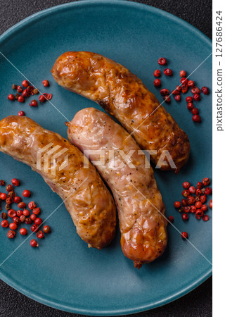 Grilled pork or beef sausages 127686424