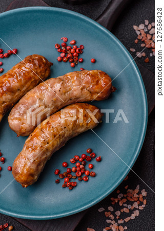 Grilled pork or beef sausages 127686428