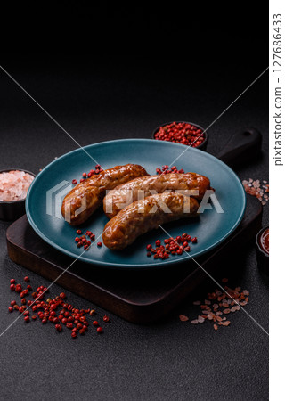 Grilled pork or beef sausages 127686433