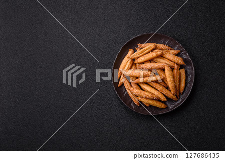 Cinnamon flavored biscuits or breadsticks Cinnamon flavored biscuits or breadsticks 127686435