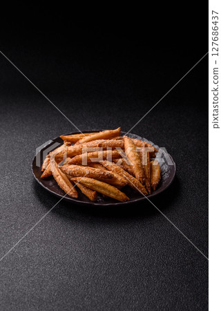 Cinnamon flavored biscuits or breadsticks Cinnamon flavored biscuits or breadsticks 127686437