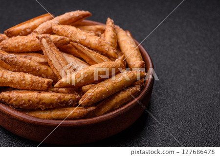 Cinnamon flavored biscuits or breadsticks 127686478
