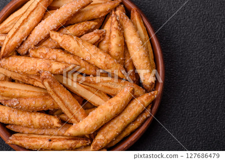 Cinnamon flavored biscuits or breadsticks Cinnamon flavored biscuits or breadsticks 127686479