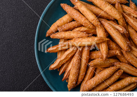 Cinnamon flavored biscuits or breadsticks 127686493