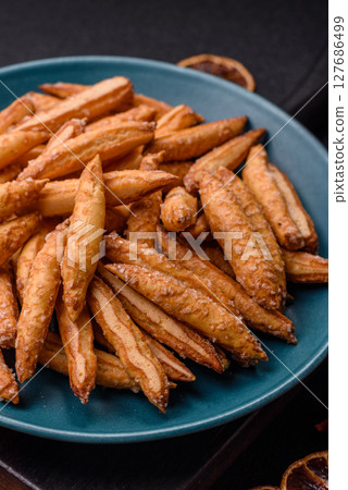 Cinnamon flavored biscuits or breadsticks 127686499