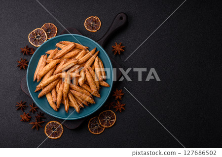 Cinnamon flavored biscuits or breadsticks 127686502