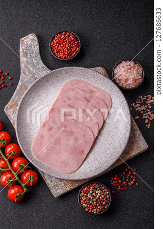 Eating ham and pork slices for the holiday table 127686633