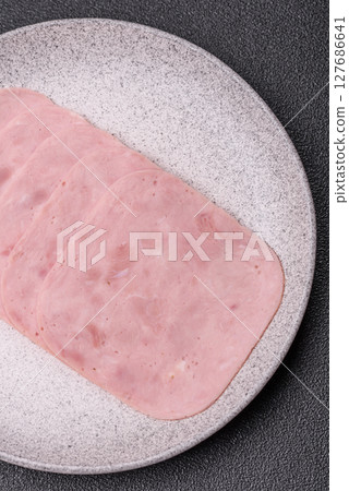Eating ham and pork slices for the holiday table 127686641