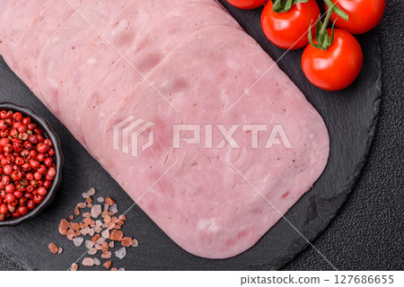 Eating ham and pork slices for the holiday table 127686655