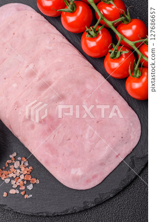 Eating ham and pork slices for the holiday table 127686657