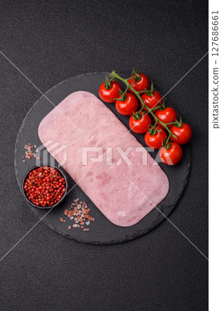 Eating ham and pork slices for the holiday table Eating ham and pork slices for the holiday table 127686661