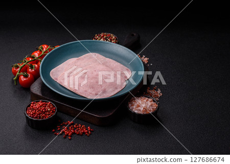 Eating ham and pork slices for the holiday table Eating ham and pork slices for the holiday table 127686674