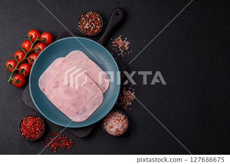 Eating ham and pork slices for the holiday table Eating ham and pork slices for the holiday table 127686675