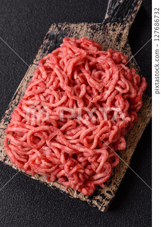 Ground beef mince fresh raw with salt and spices Ground beef mince fresh raw with salt and spices 127686732