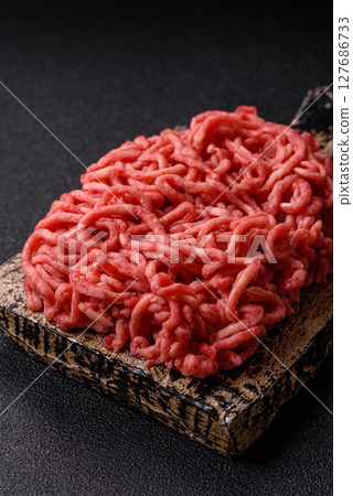 Ground beef mince fresh raw with salt and spices 127686733