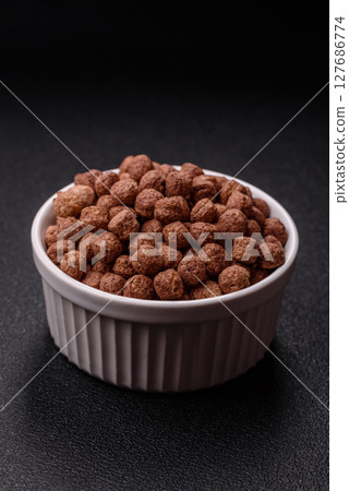 Cereal chocolate corn balls in a bowl 127686774