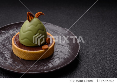 Easter sweet cake or tart in the shape of an egg Easter sweet cake or tart in the shape of an egg 127686802