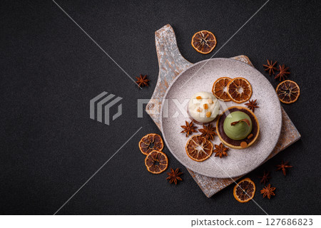 Easter sweet cake covered with icing with fruit and candied fruits 127686823