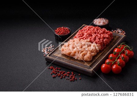 Beef and chicken minced meat, ground of two types fresh raw with salt and spices 127686831