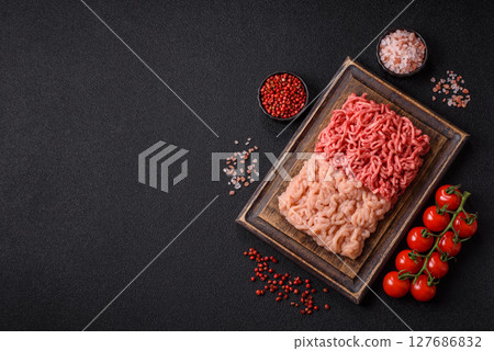 Beef and chicken minced meat, ground of two types fresh raw with salt and spices 127686832