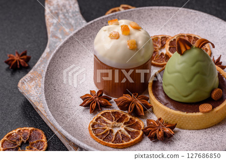 Easter sweet cake covered with icing with fruit and candied fruits Easter sweet cake covered with icing with fruit and candied fruits 127686850