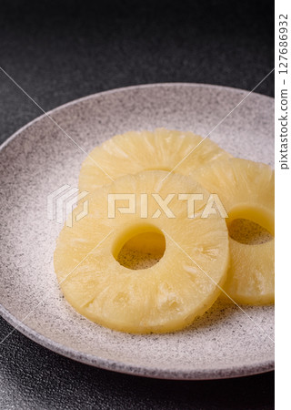 Tropical fruit pineapple in rings or slices tinned sweet Tropical fruit pineapple in rings or slices tinned sweet 127686932