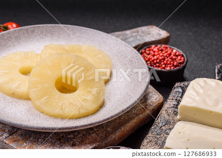 Tropical fruit pineapple in rings or slices tinned sweet Tropical fruit pineapple in rings or slices tinned sweet 127686933