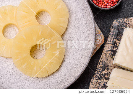Tropical fruit pineapple in rings or slices tinned sweet Tropical fruit pineapple in rings or slices tinned sweet 127686934