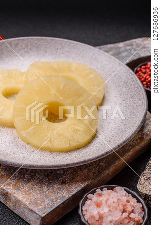 Tropical fruit pineapple in rings or slices tinned sweet 127686936