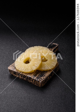 Tropical fruit pineapple in rings or slices tinned sweet Tropical fruit pineapple in rings or slices tinned sweet 127686944