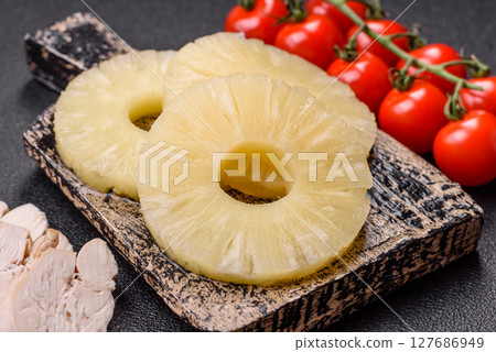 Tropical fruit pineapple in rings or slices tinned sweet Tropical fruit pineapple in rings or slices tinned sweet 127686949