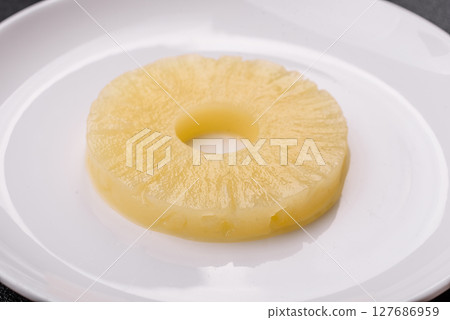 Tropical fruit pineapple in rings or slices tinned sweet Tropical fruit pineapple in rings or slices tinned sweet 127686959