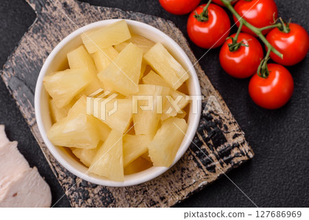 Tropical sweet tinned pineapple fruit sliced into slices 127686969