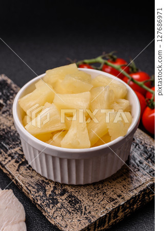 Tropical sweet tinned pineapple fruit sliced into slices Tropical sweet tinned pineapple fruit sliced into slices 127686971