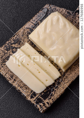 Dairy white mozzarella cheese sliced 127686998