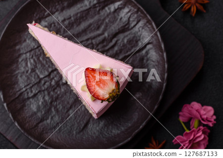 A slice of pink colored puff cake for a birthday celebration A slice of pink colored puff cake for a birthday celebration 127687133