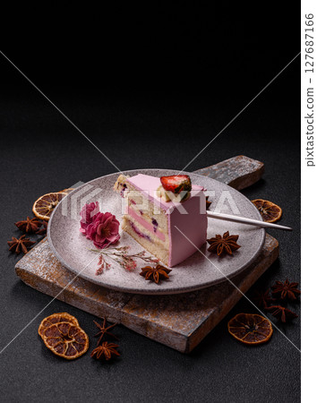A slice of pink colored puff cake for a birthday celebration A slice of pink colored puff cake for a birthday celebration 127687166