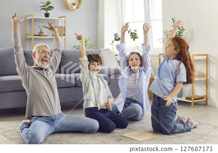 Grandma and grandpa have fun with their grandchildren Grandma and grandpa have fun with their grandchildren 127687171