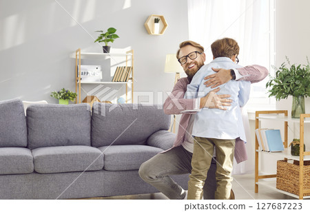 Heartwarming Hug Between Dad and Son 127687223
