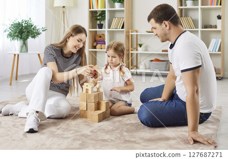 Happy friendly loving family at home close enjoy playing carefully wood cube board game together 127687271