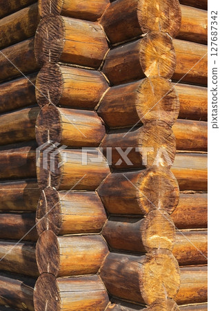 log wall. light wooden wall. environmentally friendly house. wooden blockhouse. wood fibers. log wall. light wooden wall. environmentally friendly house. wooden blockhouse. wood fibers. 127687342