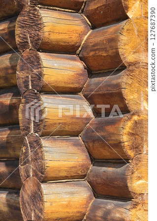 log wall. light wooden wall. environmentally friendly house. wooden blockhouse. wood fibers.  127687390
