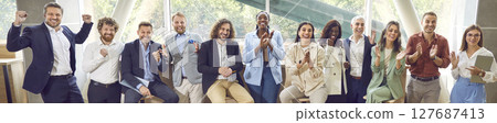 Banner with happy audience applauding after a presentation at a business conference Banner with happy audience applauding after a presentation at a business conference 127687413
