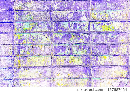Peeling paint on a brick wall. Old brick wall with cracked peeling paint. 127687434