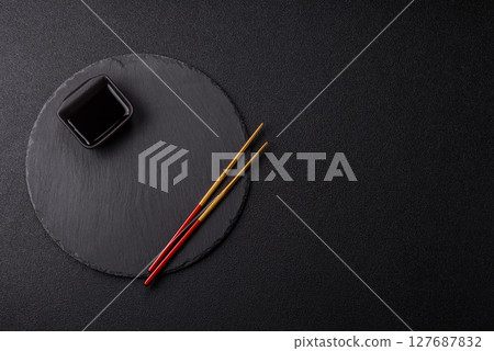 An empty plate with chopsticks for Japanese or Chinese food An empty plate with chopsticks for Japanese or Chinese food 127687832