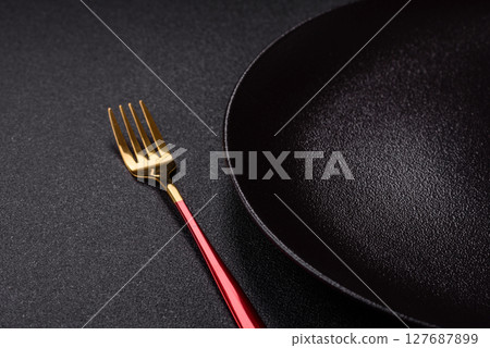 Empty plate with fork, cutlery for dinner table Empty plate with fork, cutlery for dinner table 127687899