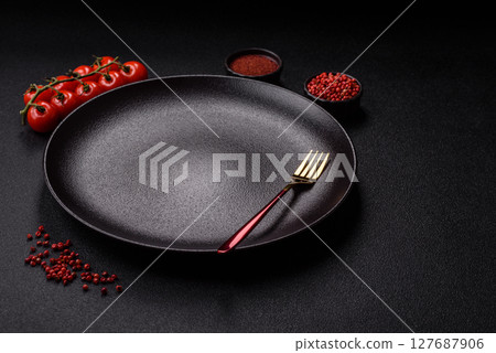 Empty plate with fork, cutlery for dinner table Empty plate with fork, cutlery for dinner table 127687906