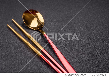 Fork, spoon, chopsticks set of kitchen utensils Fork, spoon, chopsticks set of kitchen utensils 127687971