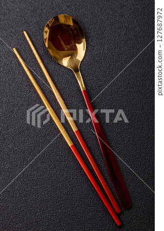 Fork, spoon, chopsticks set of kitchen utensils 127687972
