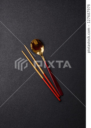 Fork, spoon, chopsticks set of kitchen utensils Fork, spoon, chopsticks set of kitchen utensils 127687976